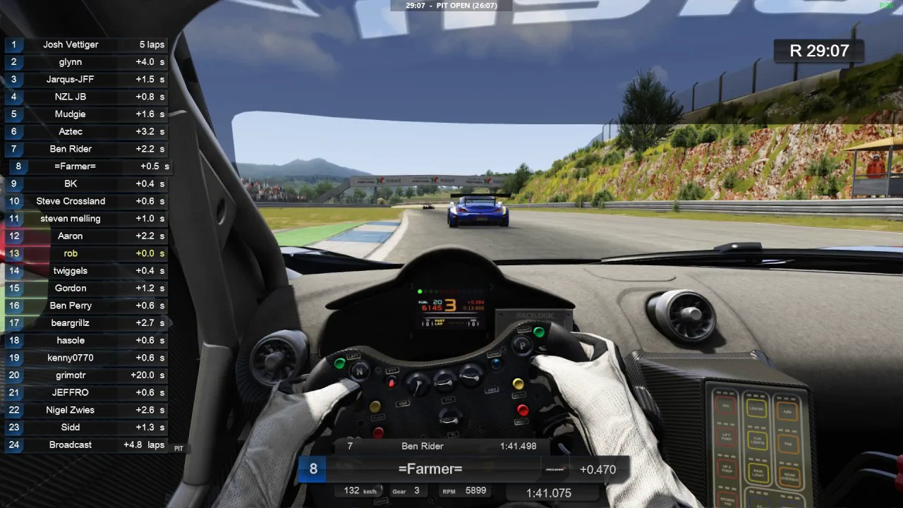 The broadcast view from inside a cockpit during a live group race, with a 24-driver position list and gaps down the left edge