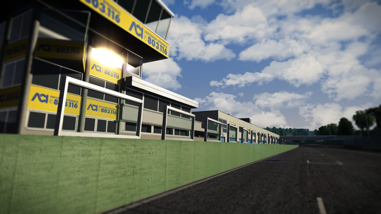 Assetto Corsa pit building with advertising boards along the pit wall